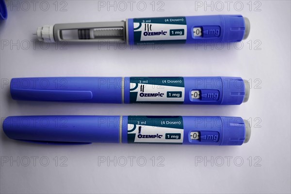 Three blue insulin pens for diabetics on a white surface, dosage of Ozempic 1mg, for diabetes 2 patients, Stuttgart, Baden-Wuerttemberg, Germany, Europe