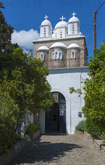 A white church and three domes rise between trees, Byzantine fortress, nunnery, monastery, Koroni, Pylos-Nestor, Messinia, Peloponnese, Greece, Europe