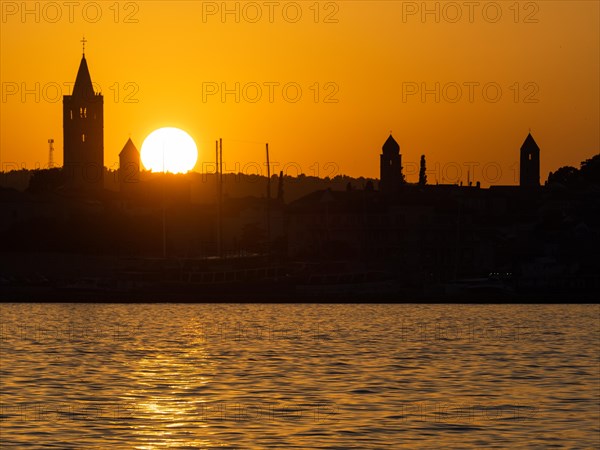 Sunset, silhouette of the church towers of Rab, town of Rab, island of Rab, Kvarner Gulf Bay, Croatia, Europe