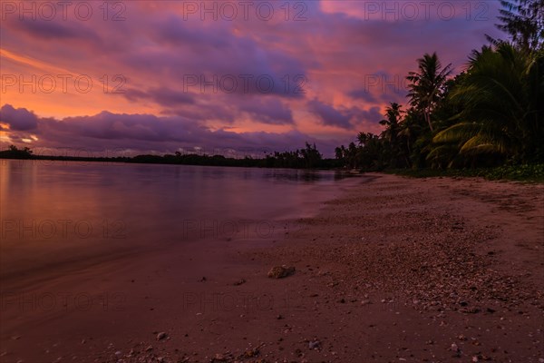 Beautiful sunset over ocean water taken from a beach in Guam