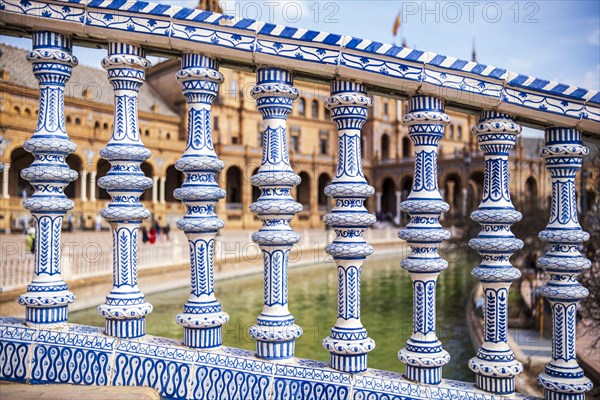 Close up of spanish tiles called azulejos on handrail at Plaza de Espana, Seville, Spain, Europe