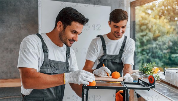 Ki generated, Two young men assemble furniture, DIY, wear gloves to protect hands from splinters and an assembly, lots of frustration and trouble, furniture assembly, do it yourself, installing a new kitchen