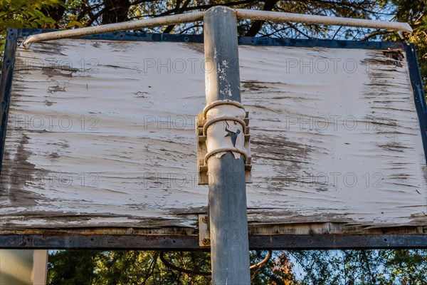 Close-up of a damaged basketball backboard showing signs of corrosion, in South Korea