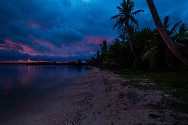 Beautiful sunset over ocean water taken from a beach in Guam