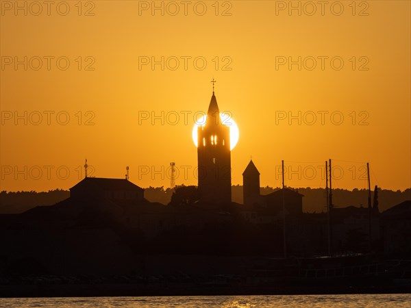 Golden evening light at sunset, silhouette of the church towers of Rab, town of Rab, island of Rab, Kvarner Gulf Bay, Croatia, Europe