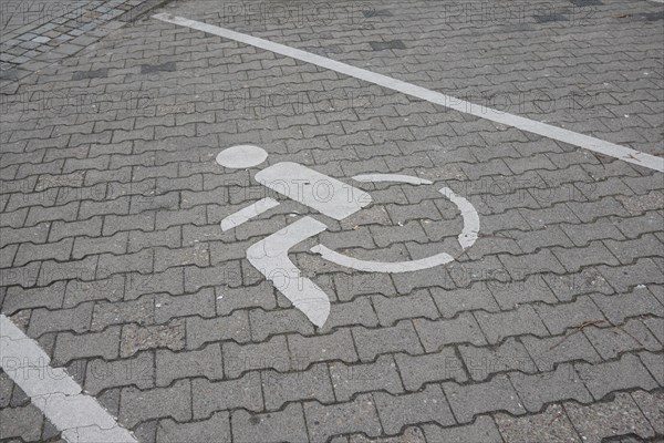 Car park, wheelchair users, road marking, paving stones, Lueneburg, Lower Saxony, Germany, Europe