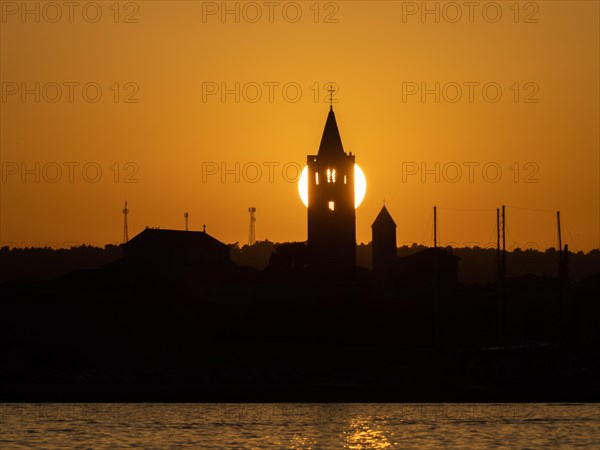 Golden evening light at sunset, silhouette of the church towers of Rab, town of Rab, island of Rab, Kvarner Gulf Bay, Croatia, Europe