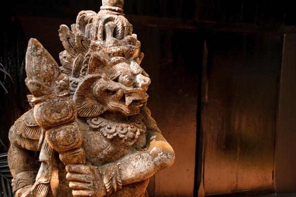 A weathered stone statue of a thai mythological creature, showcasing intricate carvings. Chiang rai, Thailand, Asia