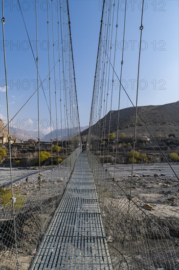 Huge hanging bridge, Chhusang village, Kingdom of Mustang, Nepal, Asia
