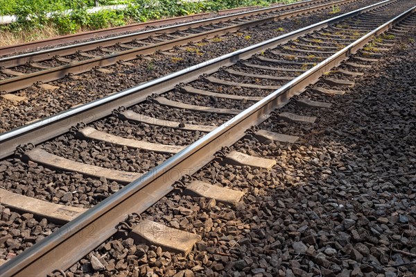 Railway tracks with wooden sleepers and ballast bed stretching into the distance, Oberhausen, North Rhine-Westphalia, Germany, Europe