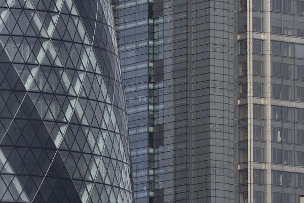 The Gherkin skyscraper building and nearby high rise office building, City of London, England, United Kingdom, Europe