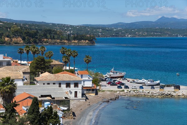 View of a quiet coastal landscape with beach, boats and houses, harbour and old town, Koroni, Pylos-Nestor, Messinia, Peloponnese, Greece, Europe