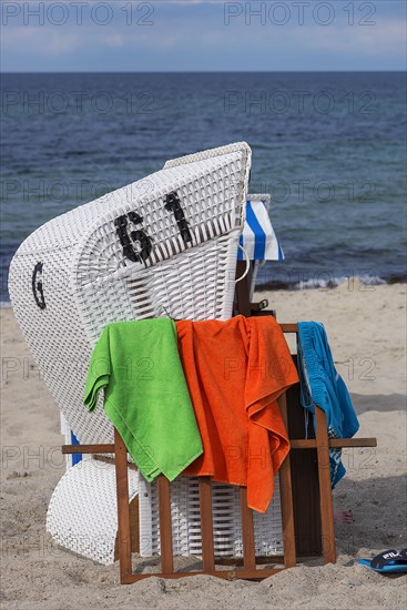 White beach chair with towels on the beach, Kuehlungsborn, Mecklenburg-Vorpommern, Germany, Europe