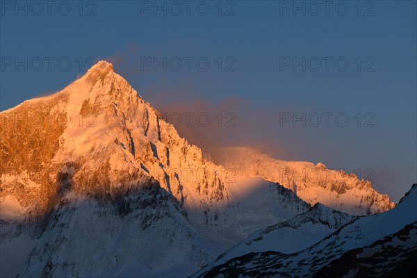 The heavily glaciated summit of Cerro San Lorenzo at sunrise, Perito Moreno National Park, Patagonia, Argentina, South America