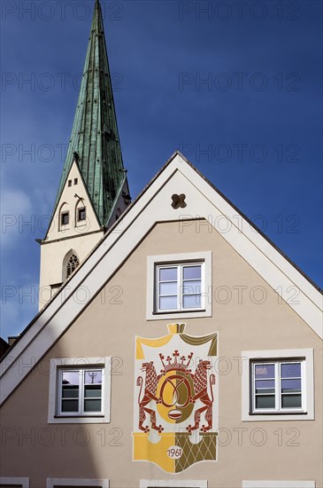 Pointed gable with royal baker's egg symbol and St.Mang church tower in Baeckerstrasse, Kempten, Allgaeu, Bavaria, Germany, Europe