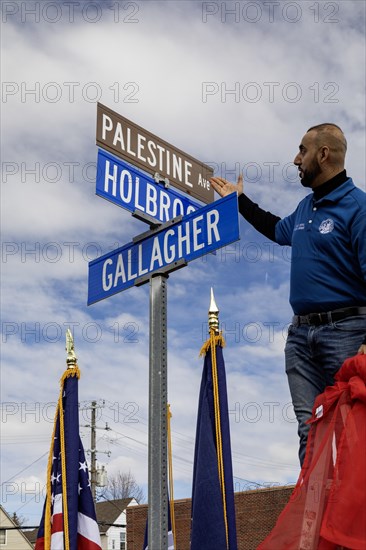 Hamtramck, Michigan USA, 7 March 2024, City councilman Khalil Refai unveils a sign renaming a major street 'Palestine Avenue.' The action is in solidarity with Palestinians in Gaza, where tens of thousands have died in Israel's bombing campaign