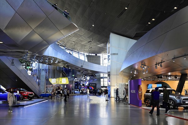 Large exhibition hall with modern vehicles and interactive displays, BMW WELT, Munich, Germany, Europe