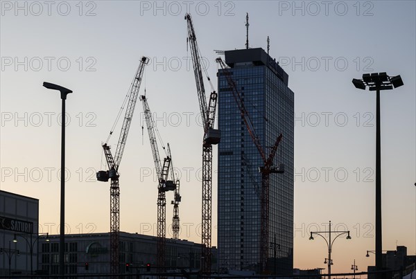 Cranes at the construction site of the Covivio high-rise, next to the Park Inn by Radisson Berlin hotel on Alexanderplatz, 08/03/2024