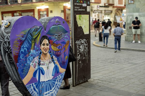 Oaxaca, Mexico, A container in the Zocalo for recycling bottles and cans, decorated and heart-shaped, Central America