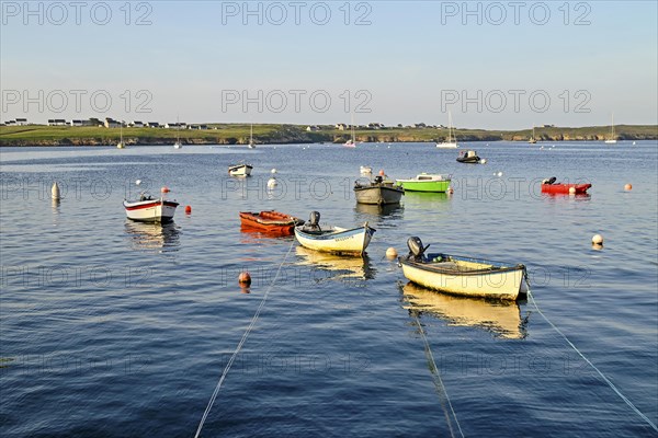 Boats on the blue waters of a bay, Ouessant Island, Finistere, Brittany, France, Europe