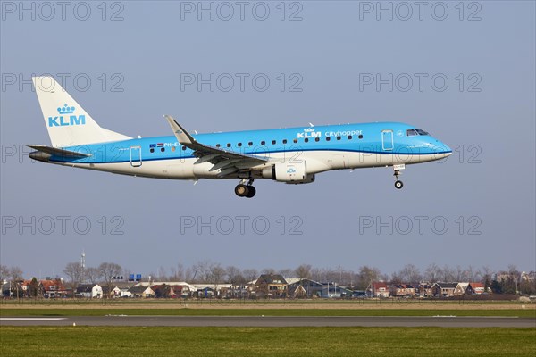 KLM Cityhopper Embraer E175STD with registration PH-EXJ approaching the Polderbaan, Amsterdam Schiphol Airport in Vijfhuizen, municipality of Haarlemmermeer, Noord-Holland, Netherlands