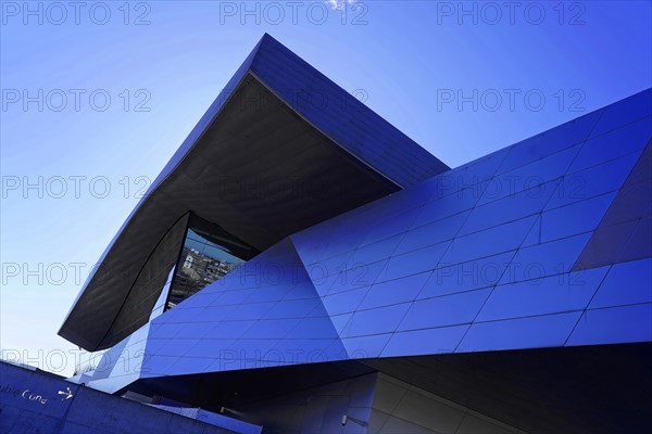 Modern building architecture with a blue facade under a clear sky, BMW WELT, Munich, Germany, Europe