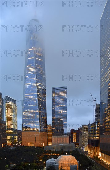 Skyscraper One World Trade Centre or Freedom Tower at the top shrouded in fog, at dusk, Ground Zero, Lower Manhattan, New York City, New York, USA, North America