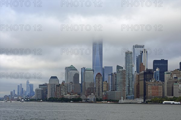 Skyline with skyscrapers in the Financial District, One World Trade Centre or Freedom Tower in the clouds, Hudson River, Lower Manhattan, New York City, New York, USA, North America