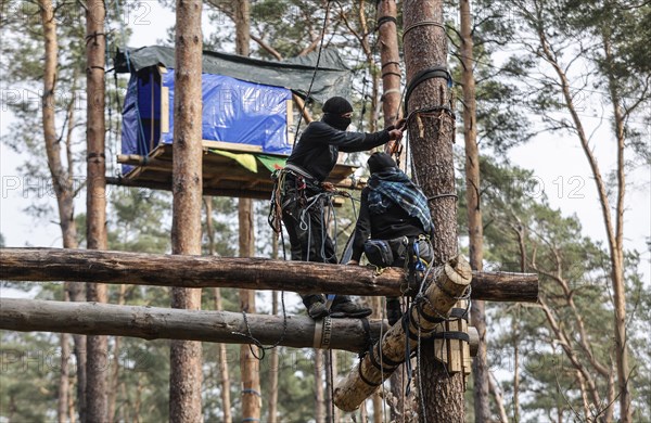 Climate activists build more tree houses in Gruenheide forest. The activist group Stop Tesla has built tree houses in the forest to protest against the planned expansion of the Tesla plant, 04.03.2024