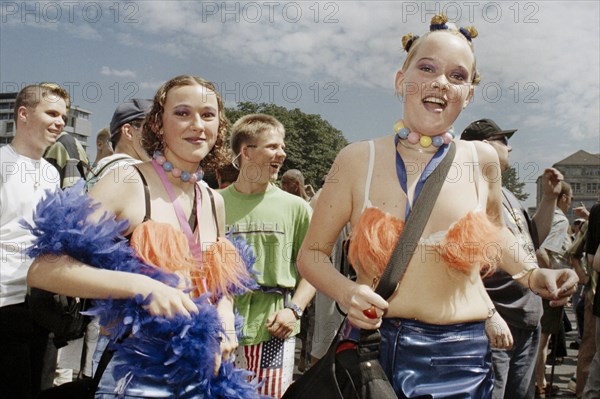 Techno fans celebrate during the Love Parade. Under the motto Let the sun shine to your heart, techno music fans celebrate the 9th Love Parade with more than a million visitors in Berlin on 12 July 1997