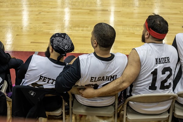 Hamtramck, Michigan USA, 8 March 2024, Arab-Americans from Hamtramck and Dearborn, Michigan faced off in a charity fundraising basketball game and children's tug-of war. The event raised money for charities in Palestine and Yemen. Members of the Dearborn team on the bench