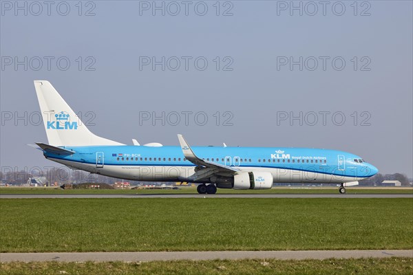 KLM Boeing 737-8K2 with registration PH-BCH lands on the Polderbaan, Amsterdam Schiphol Airport in Vijfhuizen, municipality of Haarlemmermeer, Noord-Holland, Netherlands