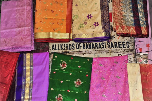Colourful selection of saris with different patterns at a market, Varanasi, Uttar Pradesh, India, Asia