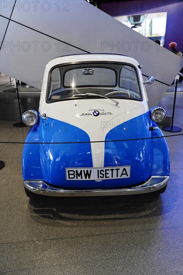 A historic blue and white BMW Isetta car model in an exhibition hall, BMW WELT, Munich, Germany, Europe