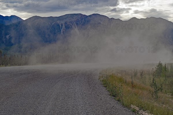 Long plume of dust on a gravelled section of the Alaska Highway, Yukon Territory, Canada, North America