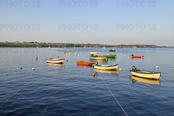 Boats on the blue waters of a bay, Ouessant Island, Finistere, Brittany, France, Europe