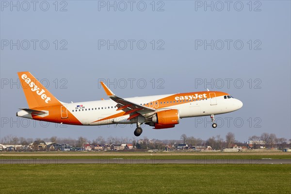 EasyJet Europe Airbus A320-251N with registration OE-LSR lands on the Polderbaan, Amsterdam Schiphol Airport in Vijfhuizen, municipality of Haarlemmermeer, Noord-Holland, Netherlands