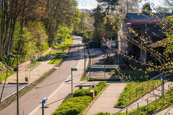 Sunny spring view of a street in a residential area with a clear sky, cycle path, Nordbahntrasse, Elberfeld, Wuppertal, Bergisches Land, North Rhine-Westphalia
