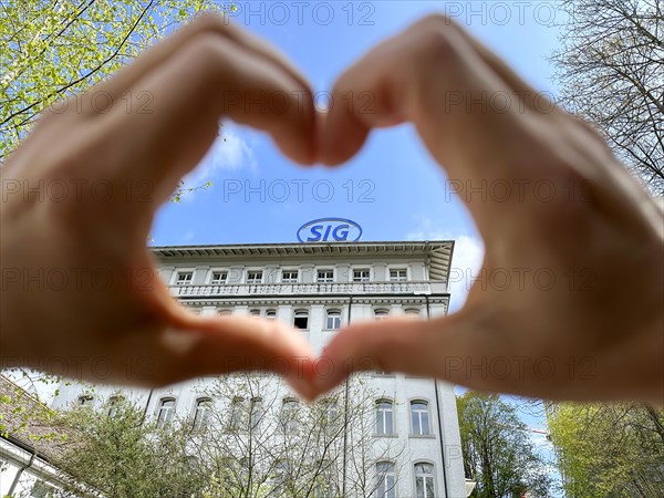 Hands Making a Heart Shape on SIG (Swiss Industrial Company) Industry Building in Neuhausen in Schaffhausen, Switzerland, Europe