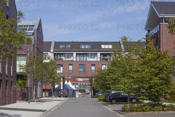 Modern brick residential building with residential street in the Nesseviertel, Leer, East Frisia, Lower Saxony