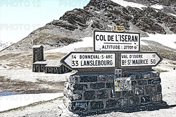 Photo with reduced dynamic saturation HDR of mountain pass alpine pass alpine mountain road alpine road pass road pass in French Alps Col de l'Iseran, Route des Grandes Alpes, Alpes-de-Haute-Provence, France, Europe