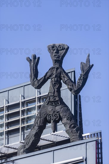 On the acute-angled corner of the building at the junction of Maxstrasse and Ostra-Allee stands a four-metre bronze sculpture of a stick figure created by A. R. Penck, Dresden, Saxony, Germany, Europe