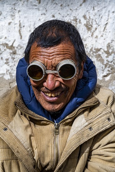 Man with historic sun glasses, Lo Manthang, Kingdom of Mustang, Nepal, Asia