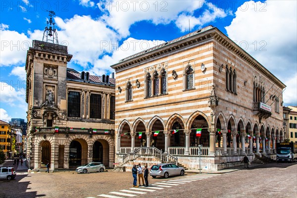 White and pink striped Loggia del Lionello in the finest Venetian Gothic style, 15th century with town hall, in Piazza della Liberta, Udine, most important historical town in Friuli, Italy, Udine, Friuli, Italy, Europe