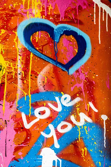 Street art, painted house wall with hearts and lettering on the theme of love, Montmartre, Paris, Ile-de-France, France, Europe