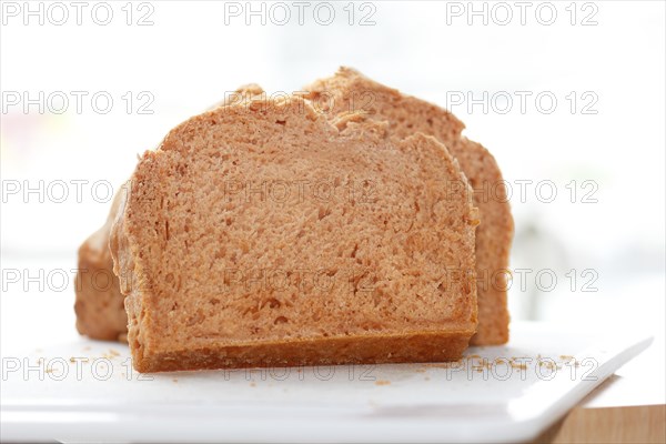 Wheat bread sliced on a board