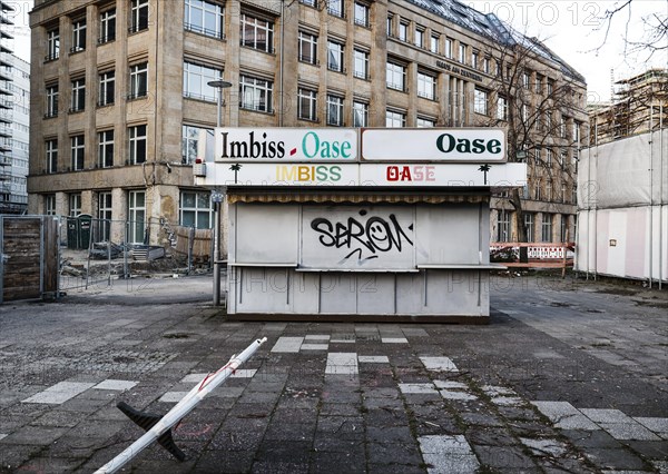 A different idea of an oasis. The closed, iconic snack bar Oase on Alexanderplatz, Berlin, 08/03/2024 stands in a building site