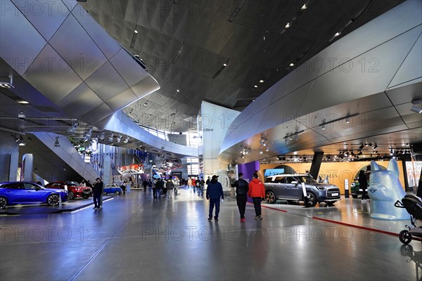 A car exhibition in a spacious hall with several visitors, BMW WELT, Munich, Germany, Europe