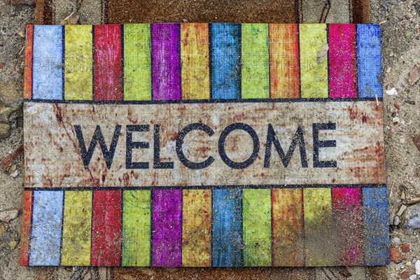 Doormat with the word welcome, greeting, friendly, inviting, colourful, colourful, decoration, word, colourful, greeting, greeting message, background, texture, carpet, mat, entrance, front door