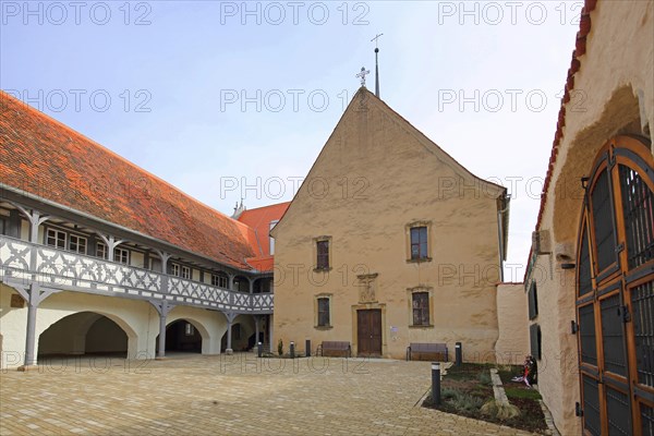 Hospital with arcade and hospital church, historic half-timbered house, inner courtyard, Ochsenfurt, Lower Franconia, Franconia, Bavaria, Germany, Europe